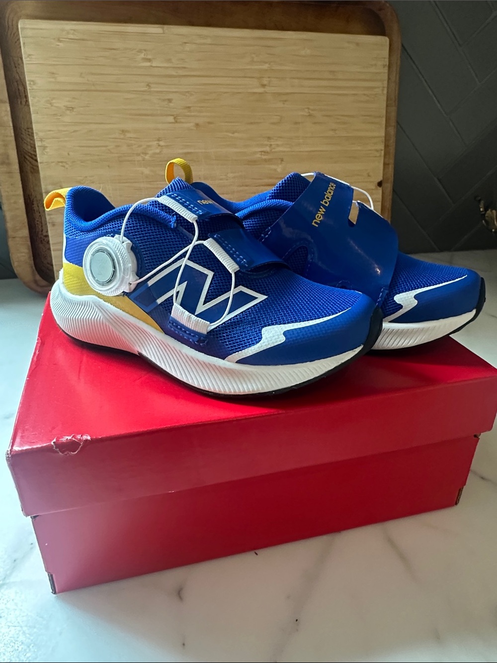 New Balance Kids Blue and Yellow Athletic Sneakers with White Accents